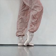 a person wearing pink pants and ballet shoes