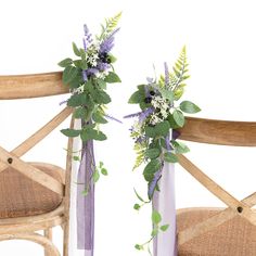 two vases filled with flowers sitting on top of a wooden chair next to each other