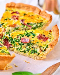 a quiche with cheese and spinach on top