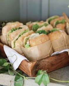 some food is sitting on a wooden tray