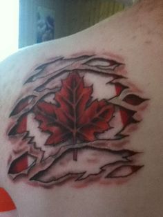 a man's back with a red maple leaf on it