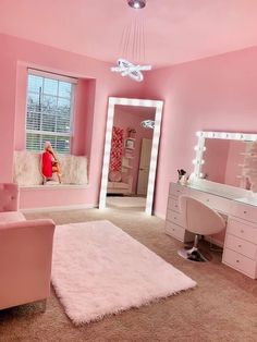 a bedroom with pink walls and white furniture