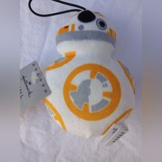 a star wars plush toy with a tag attached to it