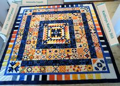 a quilt is on display in a store