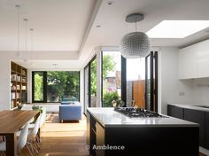 the kitchen is clean and ready to be used as a dining room or living room