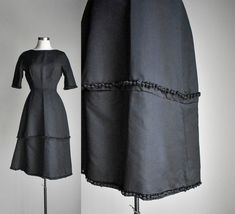 "ABOUT: Vintage late 50s early 60s black cocktail dress with super structured 2 tier skirt with tassels throughout. It features a classy scoop neckline, short sleeves and zips at the back. Dress is unlined. TAG: The Jenny Shoppe Washington DC TAG SIZE: no size FITS LIKE:XS in womens due to the 22\" waist -  see measurements below Please compare measurements to a like item in your wardrobe that already fits. MEASUREMENTS- (taken with garment laying flat in inches, not doubled) shoulder: 16\" pit Skirt With Tassels, Vintage Wrangler Jeans, Prairie Skirt, Early 60s, Formal Cocktail Dress, Black Formal, Vintage Wrangler, Black Cocktail, Linen Skirt