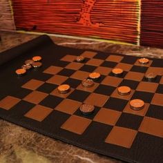 a chess board with several pieces on it and a painting in the backround