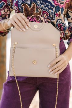 This taupe purse is the definition of classic and chic! The contrasting fabric is gorgeous and we love the gold hardware. This clutch is going to look amazing with so many dressier outfits. Taupe Shoulder Bag With Gold-tone Hardware For Formal Occasions, Elegant Workwear Clutch With Detachable Strap, Chic Brown Clutch With Chain Strap, Elegant Workwear Clutch With Removable Pouch, Elegant Neutral Shoulder Bag With Gold-tone Hardware, Formal Beige Shoulder Bag With Fold Over Clasp, Elegant Shoulder Bag With Detachable Strap For Day Out, Chic Brown Spring Clutch, Classic Blush Shoulder Bag For Formal Occasions