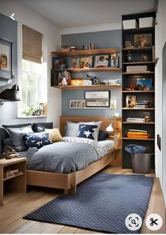 a bedroom with a bed, desk and bookshelf in the middle of it