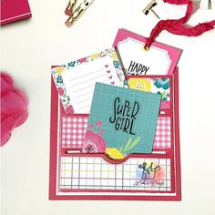 a close up of a greeting card on a table with other cards and decorations around it