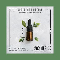 a bottle of green cosmetics sitting on top of a white table next to some leaves