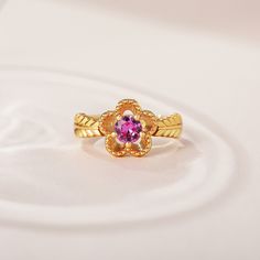 The fashion ring features a sparkling center stone with sculpted petals of a flower, and meaningful engravings inside the band. Give her this masterpiece as a gift to make her feel loved, cared for and pampered.Weight: 3.5 gHeight: 10.25 mmMaterial: 925 SilverPlating Color: Yellow Gold Elegant Flower-shaped Diamond Cut Rings, Elegant Flower Shaped Ring For Anniversary, Elegant Flower Ring For Anniversary, Luxury Flower Diamond Cut Ring As Gift, Luxury Diamond Cut Flower Ring For Gift, Elegant Promise Flower Ring With Birthstone, Elegant Flower Rings For Anniversary, Elegant Flower-shaped Rings For Anniversary, Elegant Flower-shaped Promise Ring