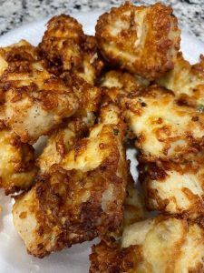 some fried food is on a white plate