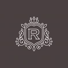 the letter r in a decorative frame on a dark background