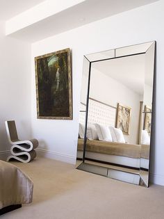 a large mirror sitting in the middle of a room