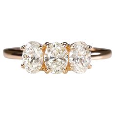 three stone diamond ring in yellow gold