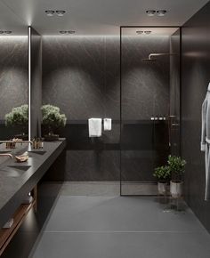 a large bathroom with two sinks and a robe hanging on the wall next to it