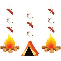 three hot dogs hanging over a campfire