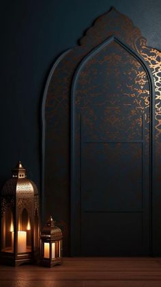 two lit candles sit in front of an intricately designed wall and door with ornate carvings