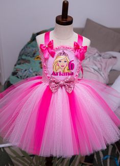 Barbie inspired tutu dress, super full skirt with triple layered tutu.  this dress can be made in any size up to 12 years each dress comes with free name and age personalisation but can also be made plain with just the image of you prefer so please leave details in the note to seller box.  🎀please also attach the date of event you need this by so I can make sure it arrives in time as each item is made to order.  thank you! Pink And Sparkly, Kid Birthday Outfits, Pink Tutu Dress, Barbie Dresses, Barbie Inspired, Birthday Tutu Outfit, Clothes Girl