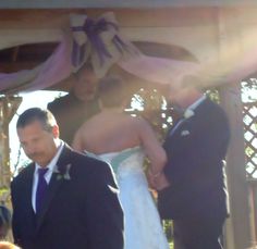 the bride and groom are walking down the aisle