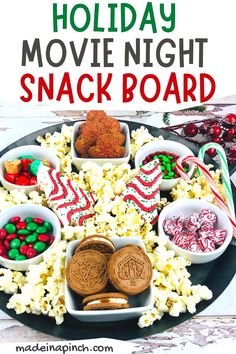 a holiday movie night snack board with candy and cookies