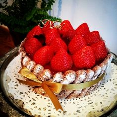 there is a cake with strawberries on top