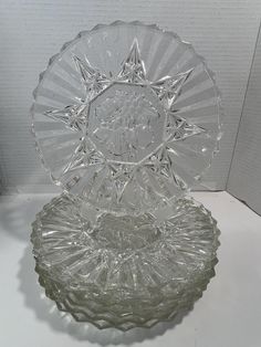 two clear glass dishes sitting on top of a table