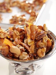 a bowl filled with nuts on top of a table