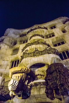 an artistic building that looks like it has been carved into the shape of a face