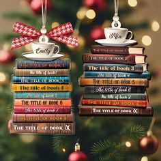 two christmas ornament shaped like books stacked on top of each other with a bow