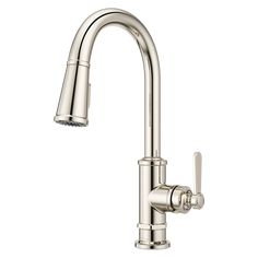 a kitchen faucet with chrome finish on the side and an angled spout