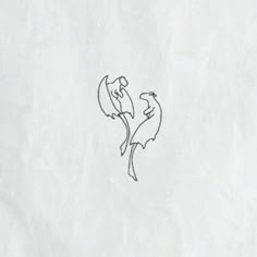 a drawing of two birds sitting on top of a piece of paper that has been drawn