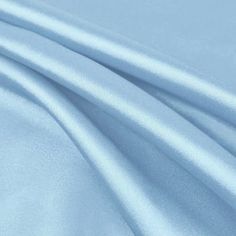 Payton DUSTY BLUE Faux Silk Stretch Charmeuse Satin Fabric - 10017 Charmeuse is a lightweight fabric woven with a satin weave, in which the warp threads cross over four or more of the backing threads. These float threads give the front of the fabric a smooth finish—lustrous and reflective—whereas the back has a dull finish. This charmeuse satin has a very soft silky feel, much like that of a silk. The luster and delicate hand make charmeuse suited to bridal gowns, lingerie, flowing evening gowns Baby Blue Aesthetic, Dress Patterns Free, Wedding Apparel, Crafts Decor, Free Dresses, Blue Aesthetic, Dusty Blue, Satin Fabric, Dressmaking