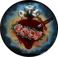 a heart with flowers and two swords on it