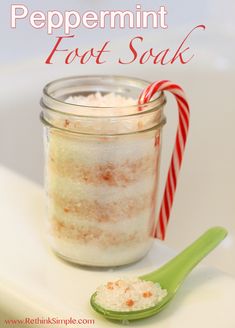 peppermint foot soak in a mason jar with candy cane on the side