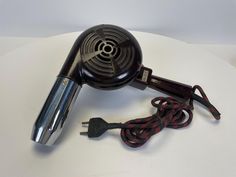 Introducing our exquisite 1950s Vintage Thermor Blow Dryer - a treasure from the past that not only whispers tales of elegance and style but also stands as a testament to timeless engineering. This meticulously preserved Thermor blow dryer isn't just an appliance; it's a slice of history that you can own, display, and yes, even use! Whether you're a collector, a lover of all things vintage, or someone who appreciates the beauty in everyday objects, this piece is sure to captivate. Its charming d Vintage Barbershop, Blow Dryer, Everyday Objects, 1950s Vintage, Vintage Beauty, Conversation Starters, Looks Vintage, Hair Styling, Barber Shop