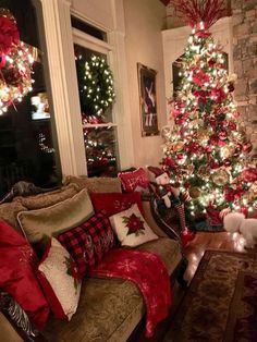 a living room with a christmas tree in the corner