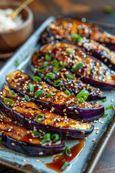 Roasted eggplant topped with sesame seeds, chopped green onions, and a savory sauce on a ceramic plate. Miso Glazed Aubergine, Japanese Side Salad, Eggplant Balsamic Recipes, Miso Eggplant Japanese, Japanese Veggie Side Dish, Japanese Vegetable Dishes, Purple Salad Recipes, Oi Muchim Recipe, Miso Glazed Eggplant Recipe