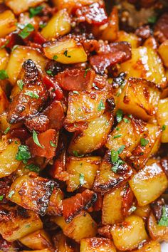 cooked potatoes with bacon and parsley in a white bowl