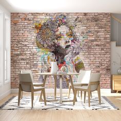 a brick wall with a painting on it in the middle of a dining room area