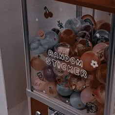 a vending machine filled with lots of different kinds of buttons and magnets on it