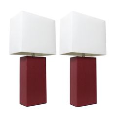 two red and white lamps sitting next to each other