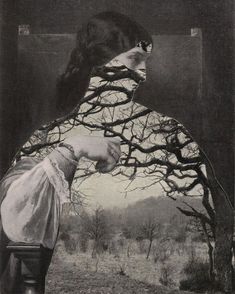 a black and white photo of a woman's face with trees in the background