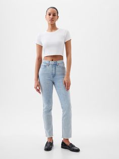 Fit: A slim, ankle-length classic.  More room than our True Skinny, but just as comfortable.  Fabric: 87% Cotton, 7% Recycled Materials, 5% Polyester, 1% Stretch.  Stretch: Stretch Jeans.  A bit of hug & a lot of hold.  Comfortable & designed to flatter.  Rise: High Rise Jeans.  Look: A classic five-pocket jean in a light indigo wash Details: Zip fly, five-pocket styling, holds-you-in front pockets, & raw hem.  Responsibly Made: This pair of jeans is part of our water-saving Washwell program.  C Fitted Slim Bottoms For Summer, Fitted Slim Summer Bottoms, Fitted High Rise Bottoms For Everyday, Gap Tapered Leg Bottoms For Everyday, Fitted Slim Bottoms For Everyday, Fitted Mid-rise Everyday Bottoms, Chic High Rise Gap Bottoms, Classic Fitted Gap Bottoms, Casual Fitted Cropped Leg Jeans