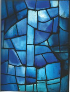 a close up view of a stained glass window with blue and white squares on it