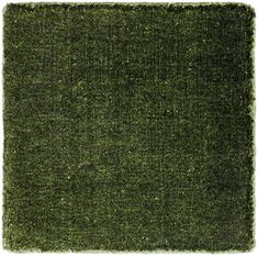 an area rug with green grass in the middle and white border at the top, on a white background