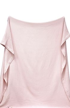 a pink top with ruffles on the shoulders