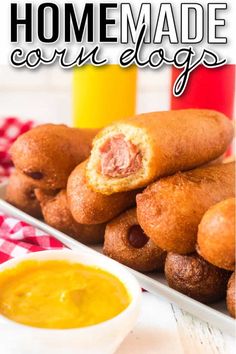 homemade corn dogs on a plate with dipping sauce