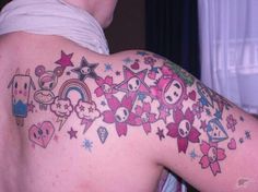 the back of a man's shoulder with tattoos on it, including stars and other things